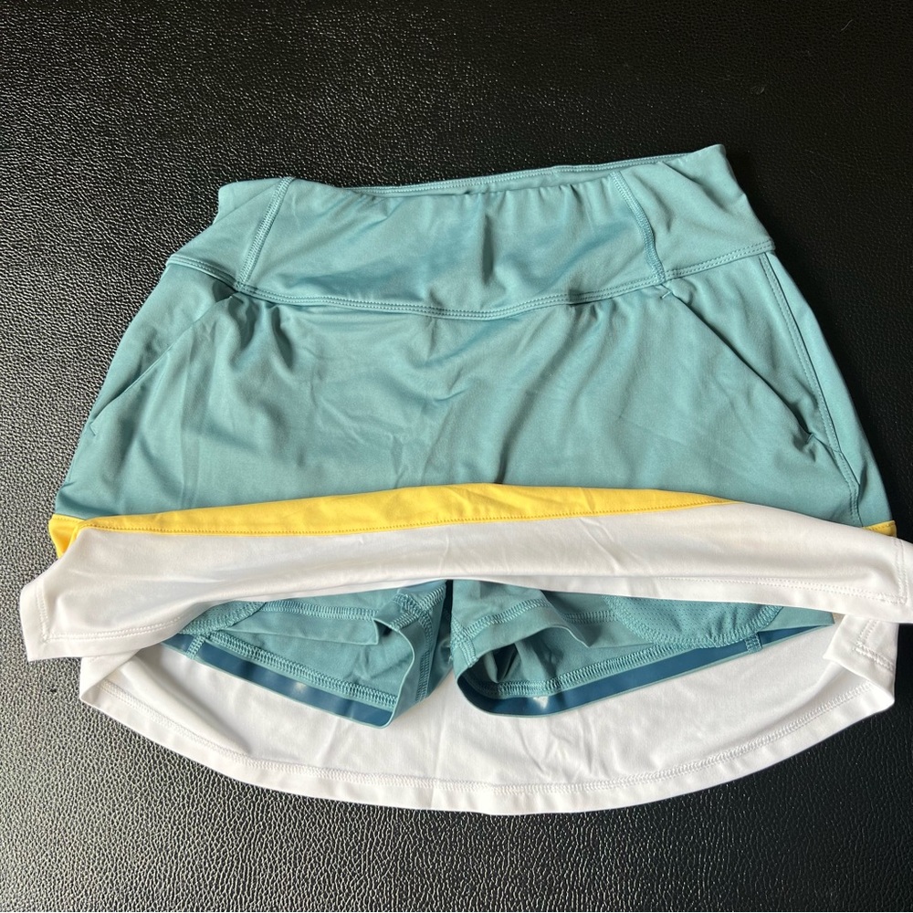 Puma Women's Teal, Yellow, and White Skort